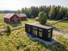 Visualisering: Shakespeare med sort facade på en gård set fra luften